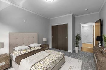 Bedroom with tufted headboard and sliding closet doors